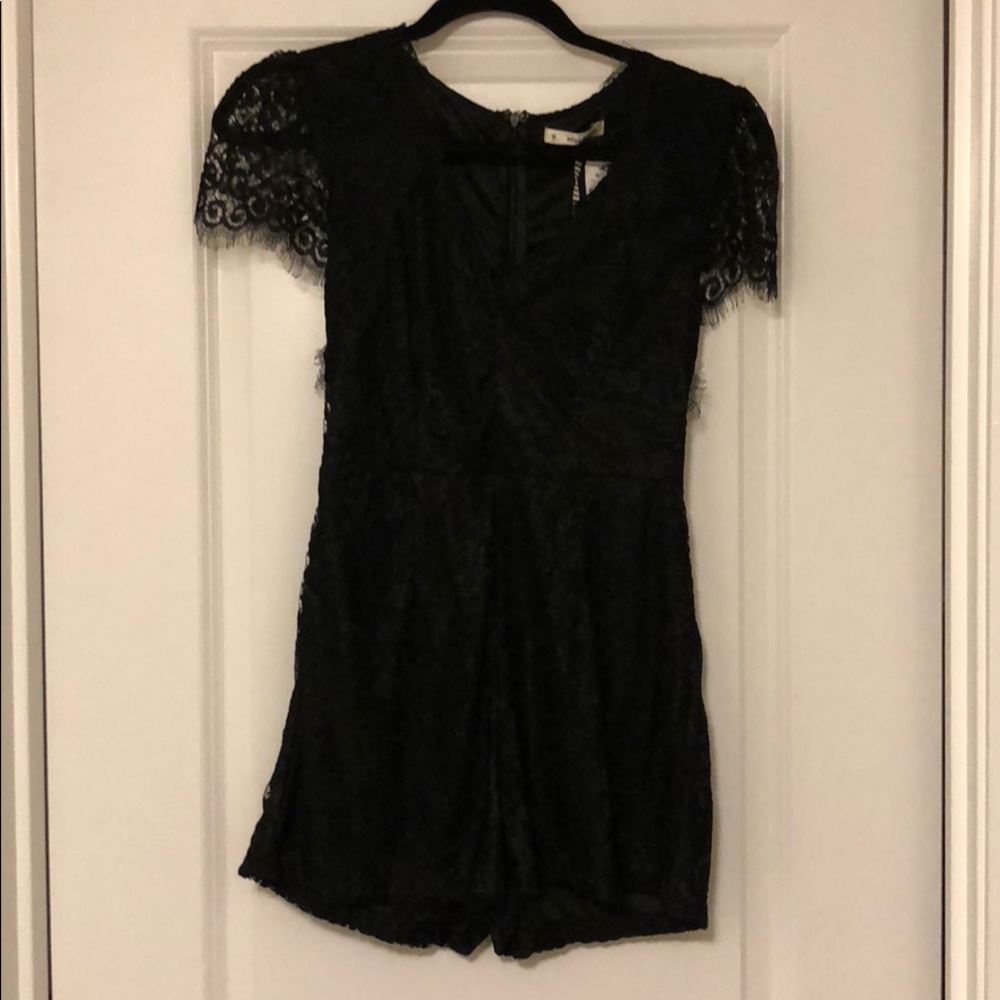 New with tags black lace romper from LF